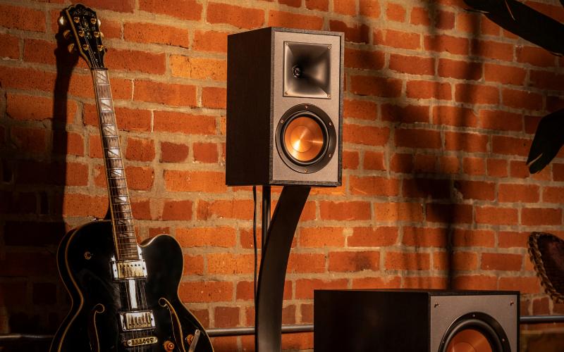 Bookshelf speaker with a guitar and subwoofer