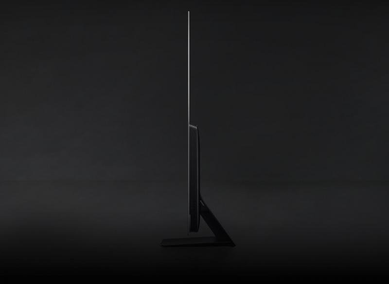 A OLED TV turns sideways to show its laser-slim design from the side.